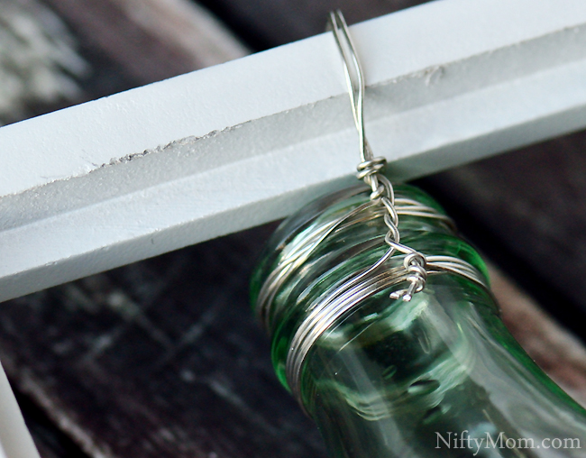 How to Hang a Coke Bottle on a Picture Frame with Wire