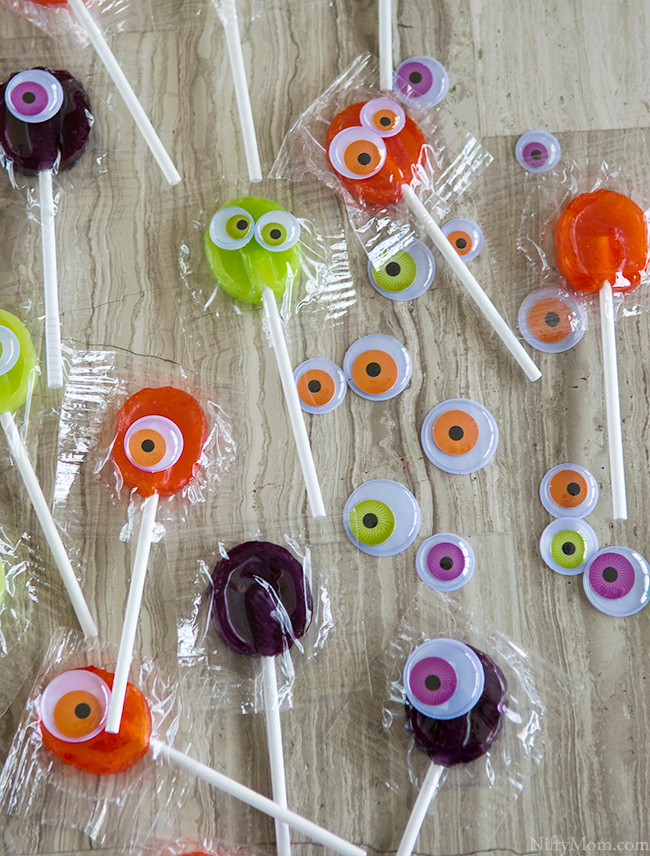 Put Googly Eyes on Lollipops to make Monster for a Halloween Party!!