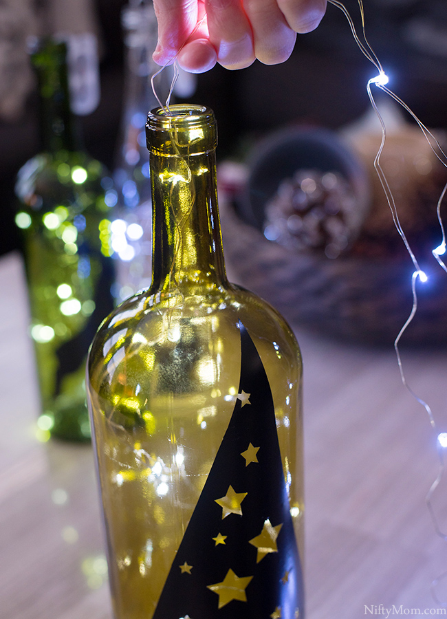 DIY Lighted Wine Bottle Holiday Decor & Centerpiece