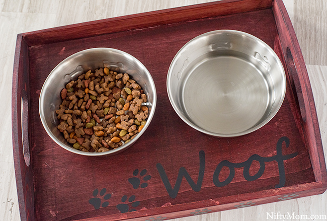 Turn a basic wooden tray into a custom dog food tray! Plus download the free file for the vinyl cutouts